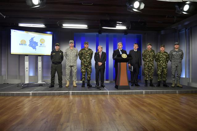 Colombian President Ivan Duque speaks during the presentation of a security report, accompanied by the military commands in the presidential palace, in Bogota, Colombia April 2, 2019. Courtesy of Colombian Presidency/Handout via REUTERS 