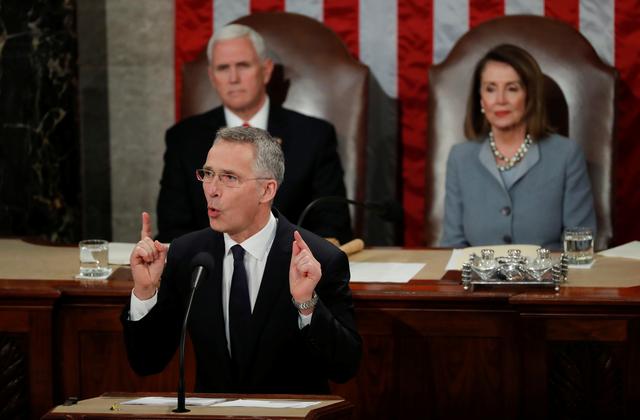 FILE PHOTO - NATO Secretary General Jens Stoltenberg addresses a joint meeting of the U.S. Congress as Vice President Mike Pence and Speaker of the House Nancy Pelosi listen in the House Chamber on Capitol Hill in Washington, U.S., April 3, 2019. REUTERS/Carlos Barria