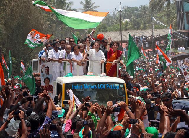 Rahul Gandhi, President of India's main opposition Congress party, and his sister a leader of Congress party Priyanka Gandhi Vadra, wave to their supporters after Rahul filed his nomination papers for the general election, in Wayanad in the southern state of Kerala, India, April 4, 2019. REUTERS/Stringer 