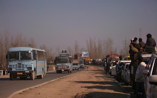 FILE PHOTO: Traffic is stopped as the Indian Central Reserve Police Force (CRPF) convoy moves along a national highway in Qazigund March 18, 2019. REUTERS/Danish Ismail/File Photo