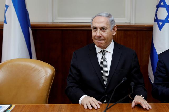 FILE PHOTO: Israeli Prime Minister Benjamin Netanyahu attends the weekly cabinet meeting at the Prime Minister's office in Jerusalem February 25, 2018. REUTERS/Gali Tibbon/Pool via Reuters/File Photo