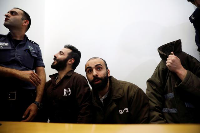 FILE PHOTO -  Romain Franck, an employee of the French consulate-general in Jerusalem, appears with co-defendants in the district court in Beersheba, Israel, March 19, 2018. REUTERS/Amir Cohen