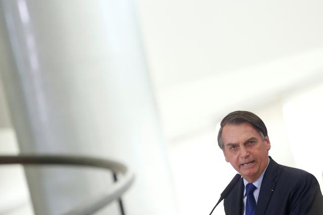 FILE PHOTO - Brazil's President Jair Bolsonaro speaks during a promotion ceremony for generals of the armed forces, at the Planalto Palace in Brasilia, Brazil April 5, 2019. REUTERS/Adriano Machado