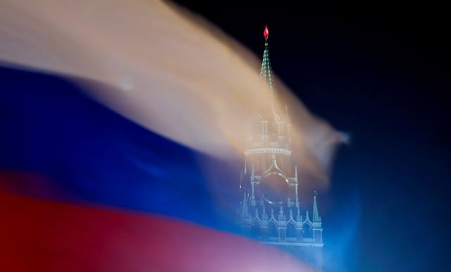 FILE PHOTO: Russian flag flies with the Spasskaya Tower of Moscow's Kremlin in the background in Moscow, Russia February 27, 2019. REUTERS/Maxim Shemetov/File Photo