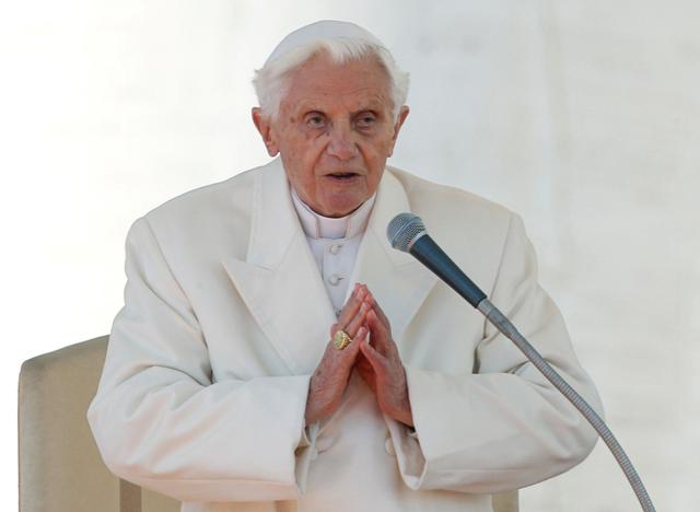 FILE PHOTO: Pope Benedict XVI finishes his last general audience in St Peter's Square at the Vatican February 27, 2013. REUTERS/Alessandro Bianchi/File Photo