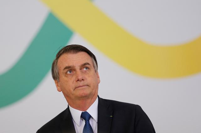 Brazil's President Jair Bolsonaro, reacts during a ceremony marking his first 100 days in office at the Planalto Palace in Brasilia, Brazil  April 11, 2019. REUTERS/Adriano Machado