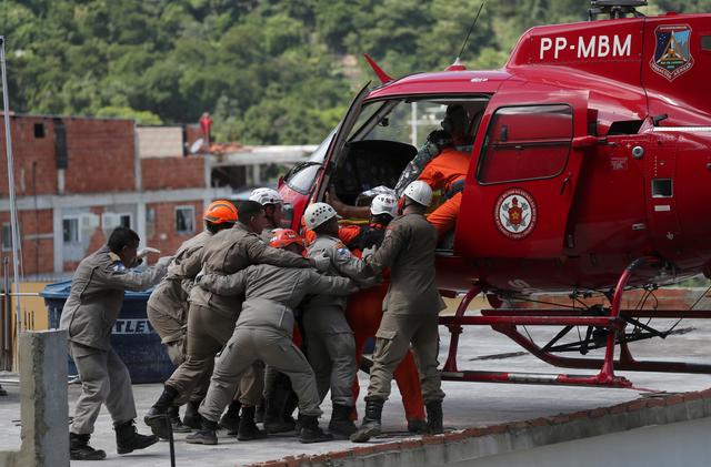 A man on a stretcher is carried to a helicopter after a building collapsed in Muzema community, Rio de Janeiro, Brazil April 12, 2019. REUTERS/Ricardo Moraes