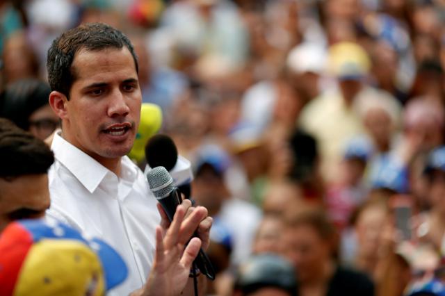 FILE PHOTO: Venezuelan opposition leader Juan Guaido, who many nations have recognized as the country's rightful interim ruler, speaks during a protest against Venezuelan President Nicolas Maduro's government in Caracas, Venezuela, April 10, 2019. REUTERS/Carlos Garcia Rawlins/File Photo