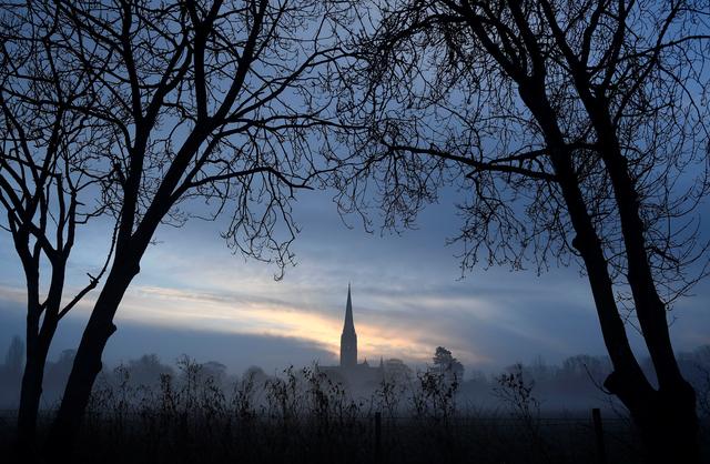 FILE PHOTO: Salisbury Cathedral, in the centre of the city in which former Russian intelligence officer Sergei Skripal and a woman were found unconscious after they had been exposed to an unknown substance is seen at dawn in Salisbury, March 7, 2018.  REUTERS/Toby Melville 