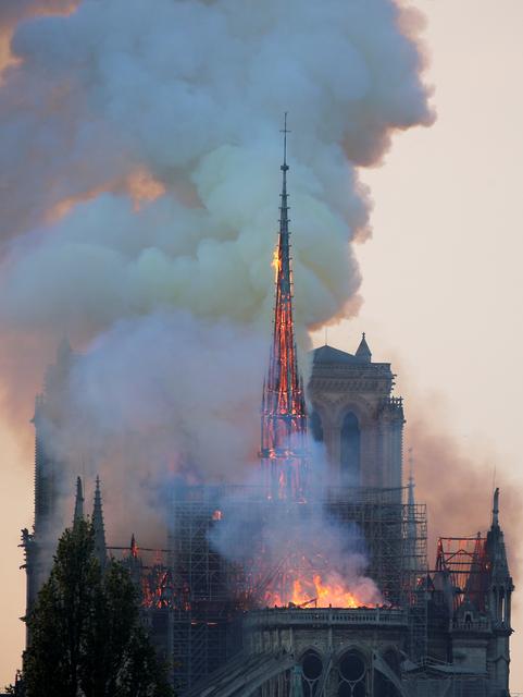 FILE PHOTO: Smoke billows from Notre Dame Cathedral after a fire broke out, in Paris, France April 15, 2019. REUTERS/Charles Platiau