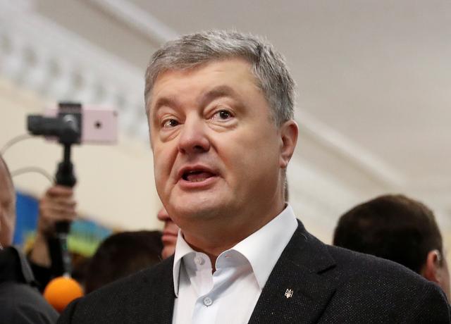 Ukraine's incumbent President and presidential candidate Petro Poroshenko addresses the media at a polling station during the second round of a presidential election in Kiev, Ukraine April 21, 2019. REUTERS/Vasily Fedosenko
