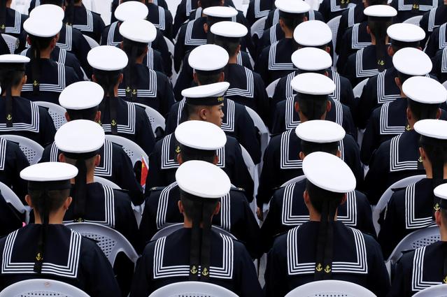 Chinese navy personnel attend an event celebrating the 70th anniversary of the founding of the Chinese People's Liberation Army Navy (PLAN) in Qingdao, China, April 22, 2019. REUTERS/Jason Lee  
