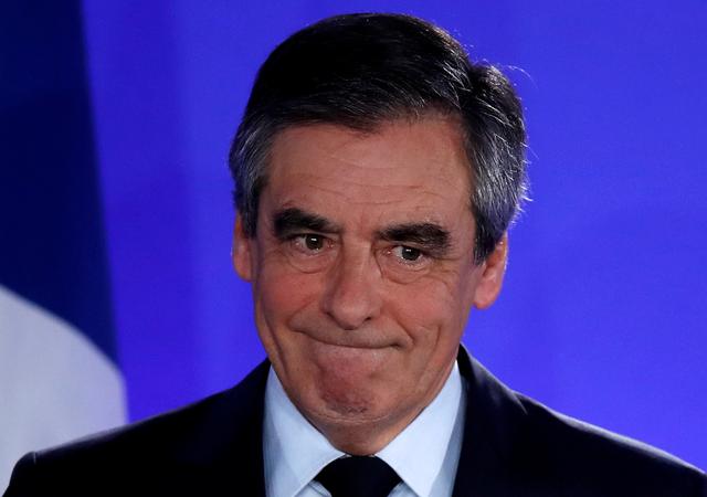 FILE PHOTO: Francois Fillon, member of the Republicans political party and 2017 French presidential election candidate of the French centre-right, reacts as he delivers a speech at his campaign headquarters in Paris after early results in the first round of 2017 French presidential election, France, April 23, 2017. REUTERS/Christian Hartmann/File Photo