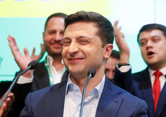 FILE PHOTO: Ukrainian presidential candidate Volodymyr Zelenskiy reacts following the announcement of the first exit poll in a presidential election at his campaign headquarters in Kiev, Ukraine April 21, 2019. REUTERS/Valentyn Ogirenko/File Photo