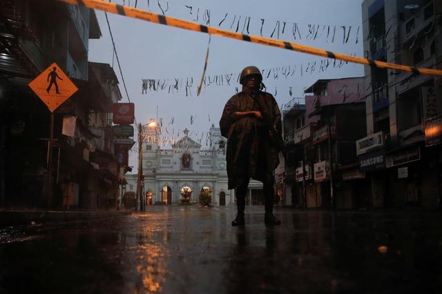 A soldier stands guard at St. Anthony's Shrine during heavy rain, days after a string of suicide bomb attacks on churches and luxury hotels across the island on Easter Sunday, in Colombo, Sri Lanka April 25, 2019. REUTERS/Thomas Peter