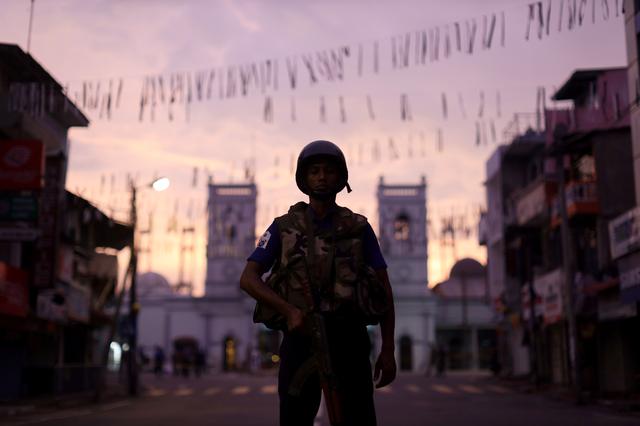 A security officer stands guard outside St. Anthony's Shrine, days after a string of suicide bomb attacks on churches and luxury hotels across the island on Easter Sunday, in Colombo, Sri Lanka April 26, 2019. REUTERS/Athit Perawongmetha