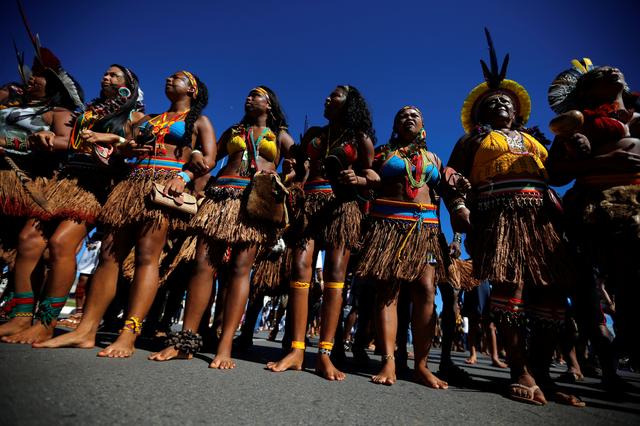 Indigenous people attend a protest to defend indigenous land and cultural rights that they say are threatened by the right-wing government of Brazil's President Jair Bolsonaro, in Brasilia, Brazil, April 26, 2019. REUTERS/Adriano Machado