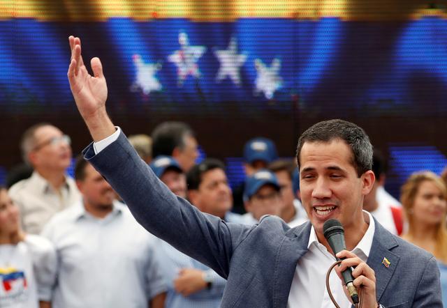 Venezuelan opposition leader Juan Guaido, who many nations have recognised as the country's rightful interim ruler, speaks during a swearing-in ceremony for supporters in Caracas, Venezuela April 27, 2019. REUTERS/Carlos Garcia Rawlins