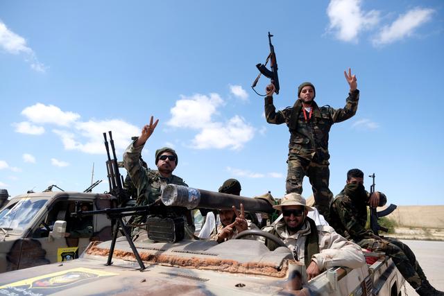 FILE PHOTO: Libyan National Army (LNA) members head out of Benghazi to reinforce troops advancing towards Tripoli, in Benghazi, Libya, April 7, 2019. REUTERS/Esam Omran Al-Fetori/File Photo