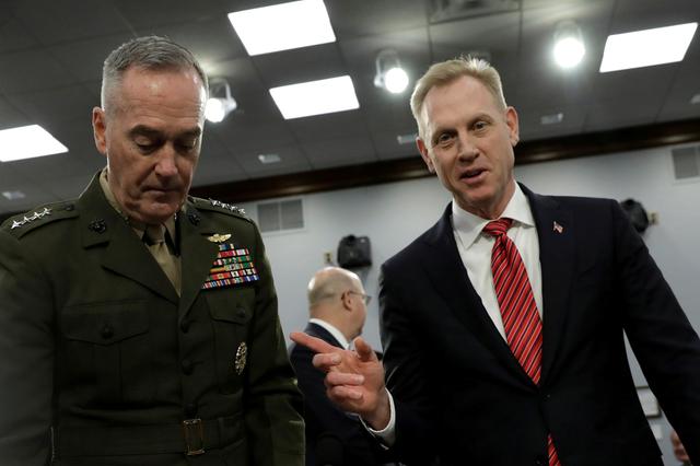 FILE PHOTO: Acting U.S. Defense Secretary Patrick Shanahan (R) points to Joint Chiefs of Staff Chairman Marine Gen. Joseph Dunford as they arrive to testify before a House Appropriations Defense Subcommittee hearing on the  Department of Defense - FY2020 Budget request on Capitol Hill in Washington, U.S., May 1, 2019. REUTERS/Yuri Gripas/File Photo