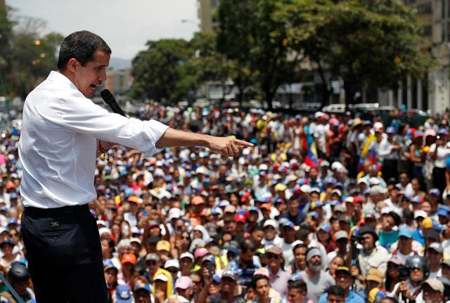 Venezuelan opposition leader Juan Guaido, who many nations have recognised as the country's rightful interim ruler, gestures as he speaks to supporters during a rally against the government of Venezuela's President Nicolas Maduro and to commemorate May Day in Caracas Venezuela, May 1, 2019. REUTERS/Carlos Garcia Rawlins