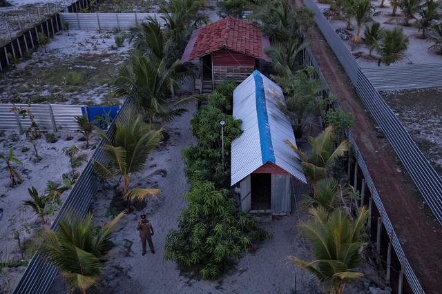 A police officer stands inside a training camp allegedly linked to Islamist militants in Kattankudy, near Batticaloa, Sri Lanka, May 5, 2019. REUTERS/Danish Siddiqui