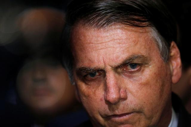 FILE PHOTO - Brazil's President Jair Bolsonaro speaks during a ceremony for signature of the decree of the new regulation on the use, sale and carrying of weapons and ammunition, at Planalto Palace in Brasilia, Brazil May 7, 2019. REUTERS/Adriano Machado