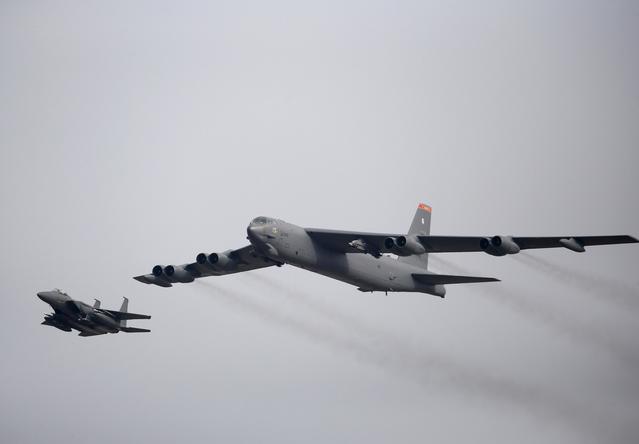 FILE PHOTO: A U.S. Air Force B-52 (R) flies over Osan Air Base in Pyeongtaek, South Korea, January 10, 2016. REUTERS/Kim Hong-Ji/File Photo