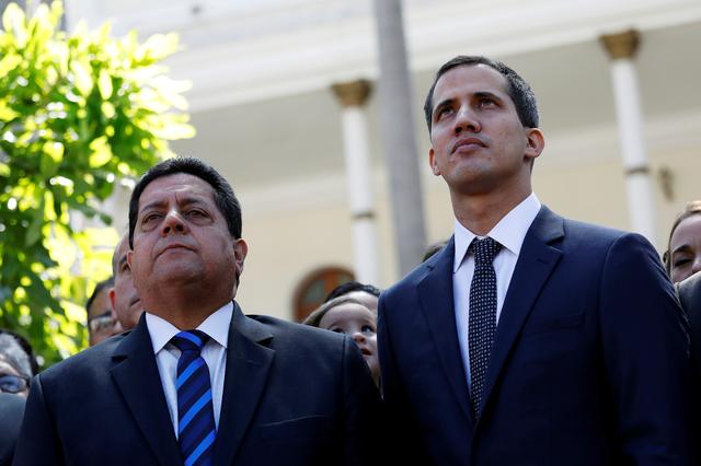 FILE PHOTO: Juan Guaido (R), new President of the National Constituent Assembly and lawmaker of the Venezuelan opposition party Popular Will (Partido Voluntad Popular), and lawmaker Edgar Zambrano of Democratic Action party (Accion Democratica), leave the congress after Guaido's swearing-in ceremony, in Caracas, Venezuela January 5, 2019. REUTERS/Manaure Quintero/File Photo