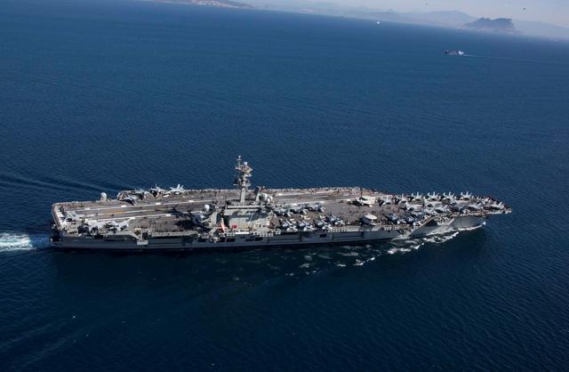 FILE PHOTO: The Nimitz-class aircraft carrier USS Abraham Lincoln (CVN 72) transits the Strait of Gibraltar, entering the Mediterranean Sea as it continues operations in the 6th Fleet area of responsibility in this April 13, 2019 photo supplied by the U.S. Navy.  U.S. Navy/Mass Communication Specialist 2nd Class Clint Davis/Handout via REUTERS