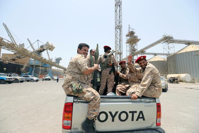 Yemen's Houthi movement forces ride in the back of vehicle during withdrawal from Saleef port in Hodeidah province, Yemen May 11, 2019.  REUTERS/Abduljabbar Zeyad