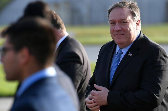 FILE PHOTO: U.S. Secretary of State Mike Pompeo walks to board a plane before departing from London Stansted Airport, north of London, Britain May 9, 2019. Mandel Ngan/Pool via REUTERS