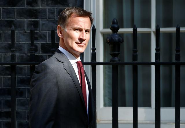 FILE PHOTO:  Britain's Foreign Secretary Jeremy Hunt is seen outside Downing Street, as uncertainty over Brexit continues, in London, Britain May 7, 2019. REUTERS/Henry Nicholls