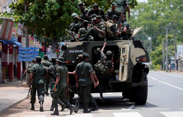 Sri Lankan soldiers patrol a road of Hettipola after a mob attack in a mosque in the nearby village of Kottampitiya, Sri Lanka May 14, 2019. REUTERS/Dinuka Liyanawatte