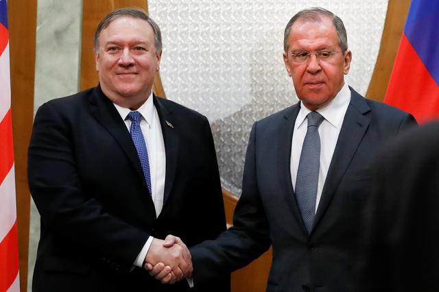 U.S. Secretary of State Mike Pompeo and Russian Foreign Minister Sergey Lavrov shake hands as they pose for a photo prior to their talks in the Black Sea resort city of Sochi, Russia, May 14, 2019. Pavel Golovkin/Pool via REUTERS