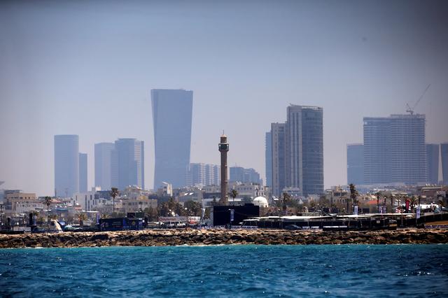 FILE PHOTO: The minaret of the Hassan Bek Mosque is seen behind the Eurovision Village, an area for fans of the 2019 Eurovision Song Contest, as seen from the Mediterranean Sea off the coast of Tel Aviv, Israel May 12, 2019. REUTERS/Ronen Zvulun/File Photo