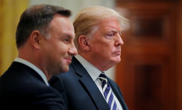 FILE PHOTO: U.S. President Donald Trump stands with Poland's President Andrzej Duda at the conclusion of a joint news conference in the East Room of the White House in Washington, U.S., September 18, 2018. REUTERS/Brian Snyder/File Photo