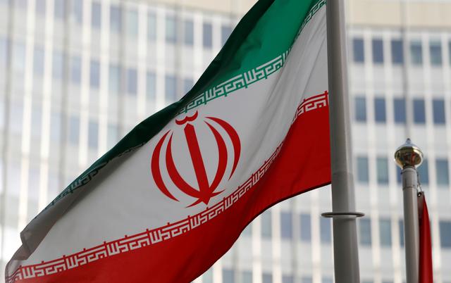 FILE PHOTO: The Iranian flag flutters in front of the International Atomic Energy Agency (IAEA) headquarters in Vienna, Austria March 4, 2019.   REUTERS/Leonhard Foeger/File Photo