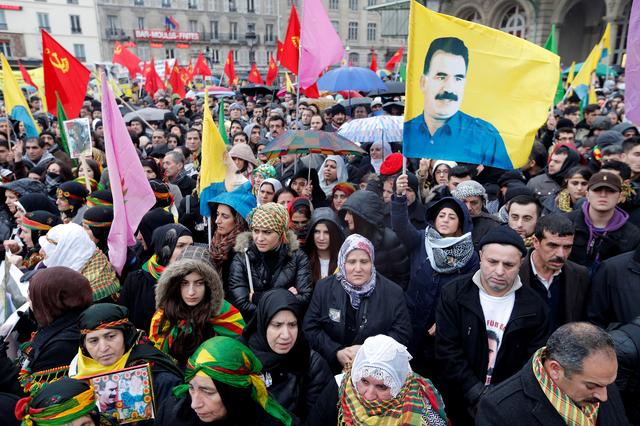 FILE PHOTO: Members of the Kurdish community in France rally in protest at the murder of three female Kurdish activists found shot to death in the Kurdish Information Centre in Paris, January 12, 2013. REUTERS/Christian Hartmann/File Photo
