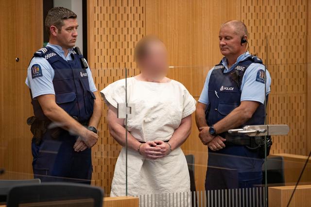 FILE PHOTO: Brenton Tarrant, charged for murder in relation to the mosque attacks, is seen in the dock during his appearance in the Christchurch District Court, New Zealand March 16, 2019.   Mark Mitchell/New Zealand Herald/Pool via REUTERS