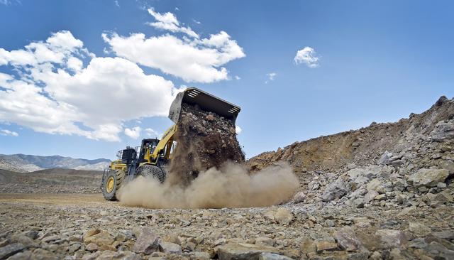 FILE PHOTO: A front-end loader is used to move material inside the open pit at Molycorp's Mountain Pass Rare Earth facility in Mountain Pass, California June 29, 2015. REUTERS/David Becker/File Photo