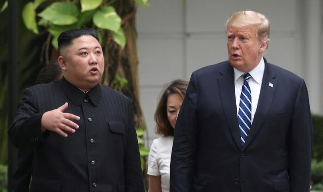 FILE PHOTO: North Korea's leader Kim Jong Un and U.S. President Donald Trump talk in the garden of the Metropole hotel during the second North Korea-U.S. summit in Hanoi, Vietnam February 28, 2019. REUTERS/Leah Millis/File Photo