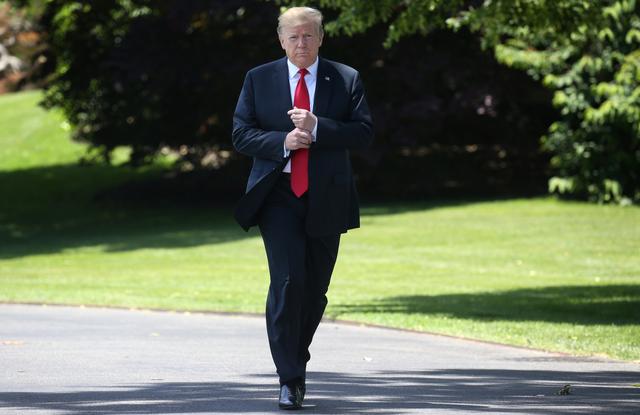 FILE PHOTO - U.S. President Donald Trump leaves the Oval Office to speak to the news media before boarding Marine One to depart for travel to Japan from the South Lawn of the White House in Washington, U.S., May 24, 2019. REUTERS/Leah Millis