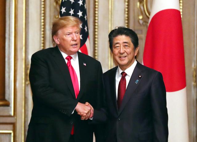 U.S. President Donald Trump shakes hands with Japanese Prime Minister Shinzo Abe prior to their working luncheon at the Akasaka guesthouse in Tokyo, Japan May 27, 2019. Yoshikazu Tsuno/Pool via REUTERS