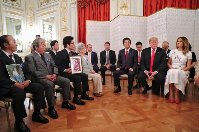 U.S. President Donald Trump, first lady Melania Trump and Japan's Prime Minister Shinzo Abe meet with family members of people abducted by North Korea in Tokyo, Japan May 27, 2019. REUTERS/Jonathan Ernst