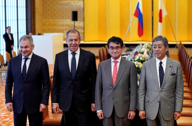 Russian Foreign Minister Sergei Lavrov and Defence Minister Sergei Shoigu pose for a photograph with Japanese Foreign Minister Taro Kono and Defense Minister Takeshi Iwaya before their two-plus-two Foreign and Defense Ministers meeting between Japan and Russia at the Iikura Guest House in Tokyo, Japan, May 30, 2019.  Franck Robichon/Pool via Reuters