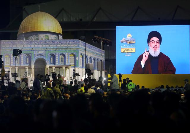 Lebanon's Hezbollah leader Sayyed Hassan Nasrallah addresses his supporters via a screen during a rally marking al-Quds Day, (Jerusalem Day) in Beirut, Lebanon May 31, 2019. REUTERS/Aziz Taher
