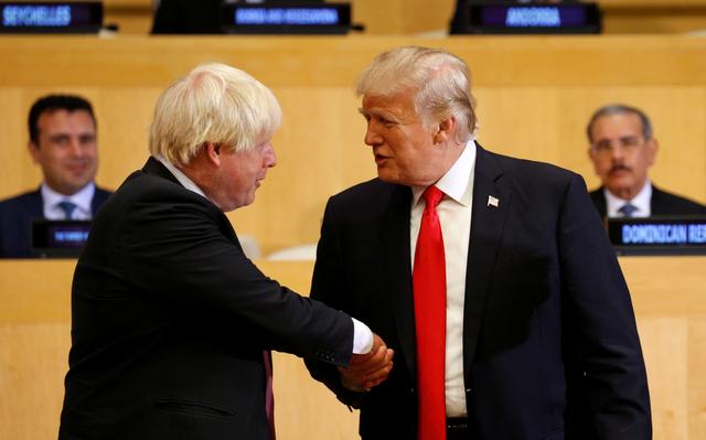 FILE PHOTO - U.S. President Donald Trump shakes hands with British Foreign Secretary Boris Johnson (L) as they take part in a session on reforming the United Nations at U.N. Headquarters in New York, U.S., September 18, 2017. REUTERS/Kevin Lamarque