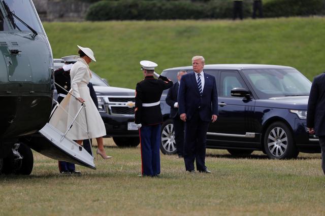 U.S. President Donald Trump and First Lady Melania Trump arrive to participate in an event to commemorate the 75th anniversary of D-Day, in Portsmouth, Britain, June 5, 2019. REUTERS/Carlos Barria