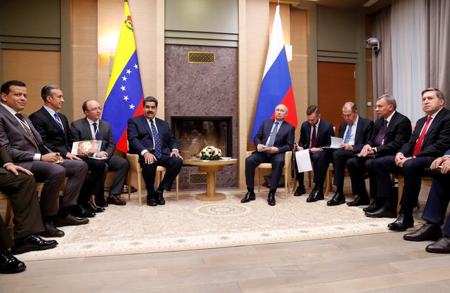 FILE PHOTO: Delegations, led by Russian President Vladimir Putin (5th R) and Venezuelan President Nicolas Maduro (4th L), hold a meeting at the Novo-Ogaryovo state residence outside Moscow, Russia December 5, 2018. REUTERS/Maxim Shemetov/File Photo